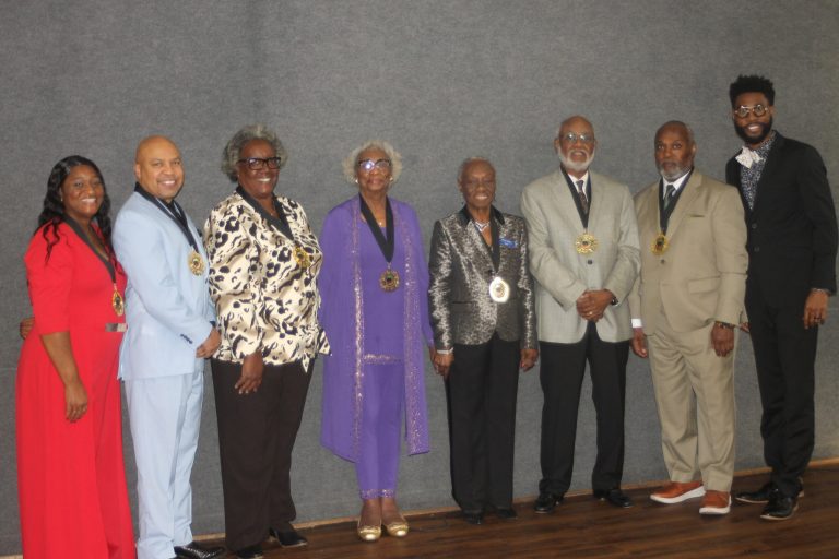 Pictured are, from left, Michelle Porter, Carl O. Sherman, Colissa Hunter (accepting for Melvin H. Hunter, Jr.), Florence Henderson (accepting for Don C. Edwards, Jr.), Shirley Watson, Jesse Gibson, Eric Smith and Jibril Rasheed. (Chris Roark/staff photo)