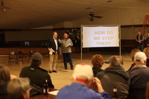 Ellis County Judge Todd Little, left, and Waxahachie resident Ernie Martinek meet with a group of Ellis County residents about municipal utility districts. (Courtesy of Corey Rogan/Ellis County)