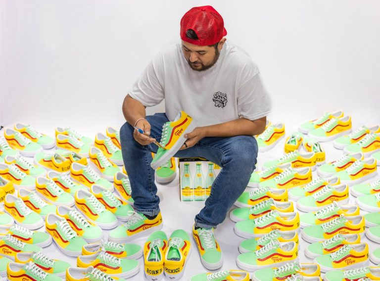 Jose Vela was commissioned by Coca-Cola to paint 77 pairs of Vans with a Topo Chico theme. (Courtesy of Joshua Cassady Media)