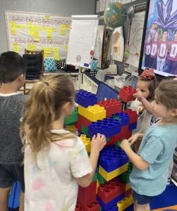 One way WISD has encouraged science, technology, engineering and math (STEM) learning is through STEM checkouts. Pictured are students working on an engineering project using large Legos. (Courtesy of WISD)